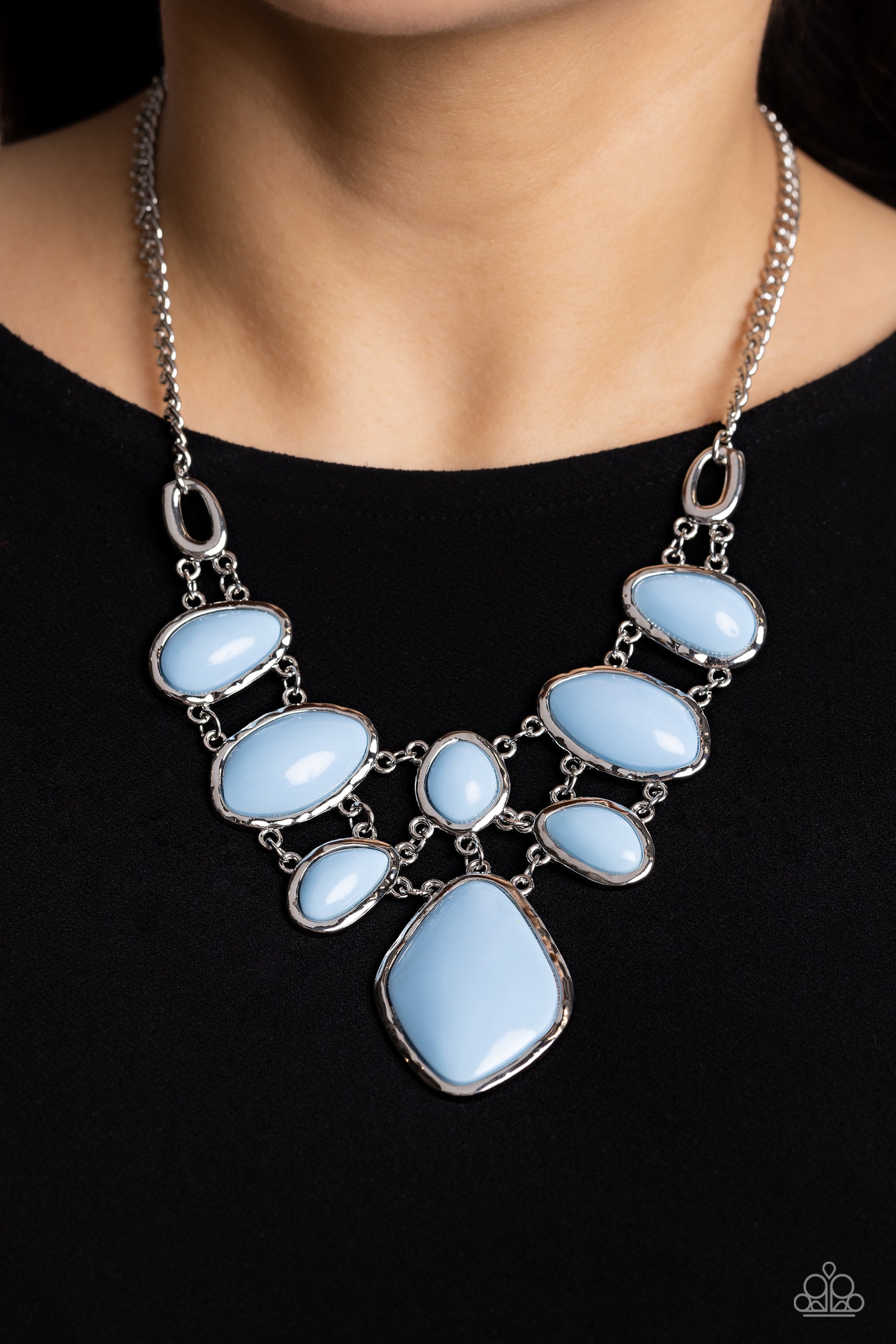 Paparazzi Accessories Dreamily Decked Out - Blue Brushed in a glossy finish, a collection of abstract Summer Song ovals in varying sizes connect end to end along the neckline in a layered display. Sleek silver frames border and wrap around each of the acr