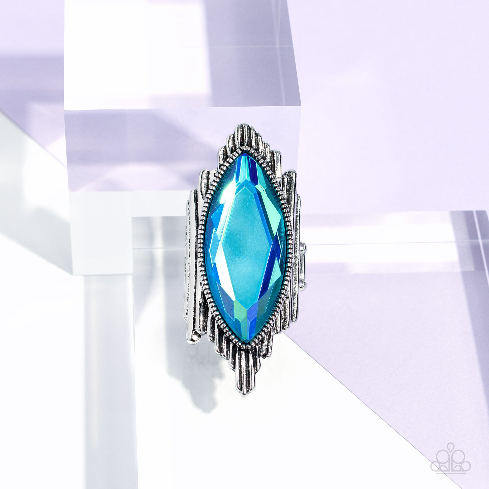 Paparazzi Accessories Stunning Showman - Green Wavy silver bars asymmetrically stack and elongate into an uneven band across the finger, resulting in an edgy fashion. Pressed in a studded silver frame and centered across the asymmetrical stack, an oversiz