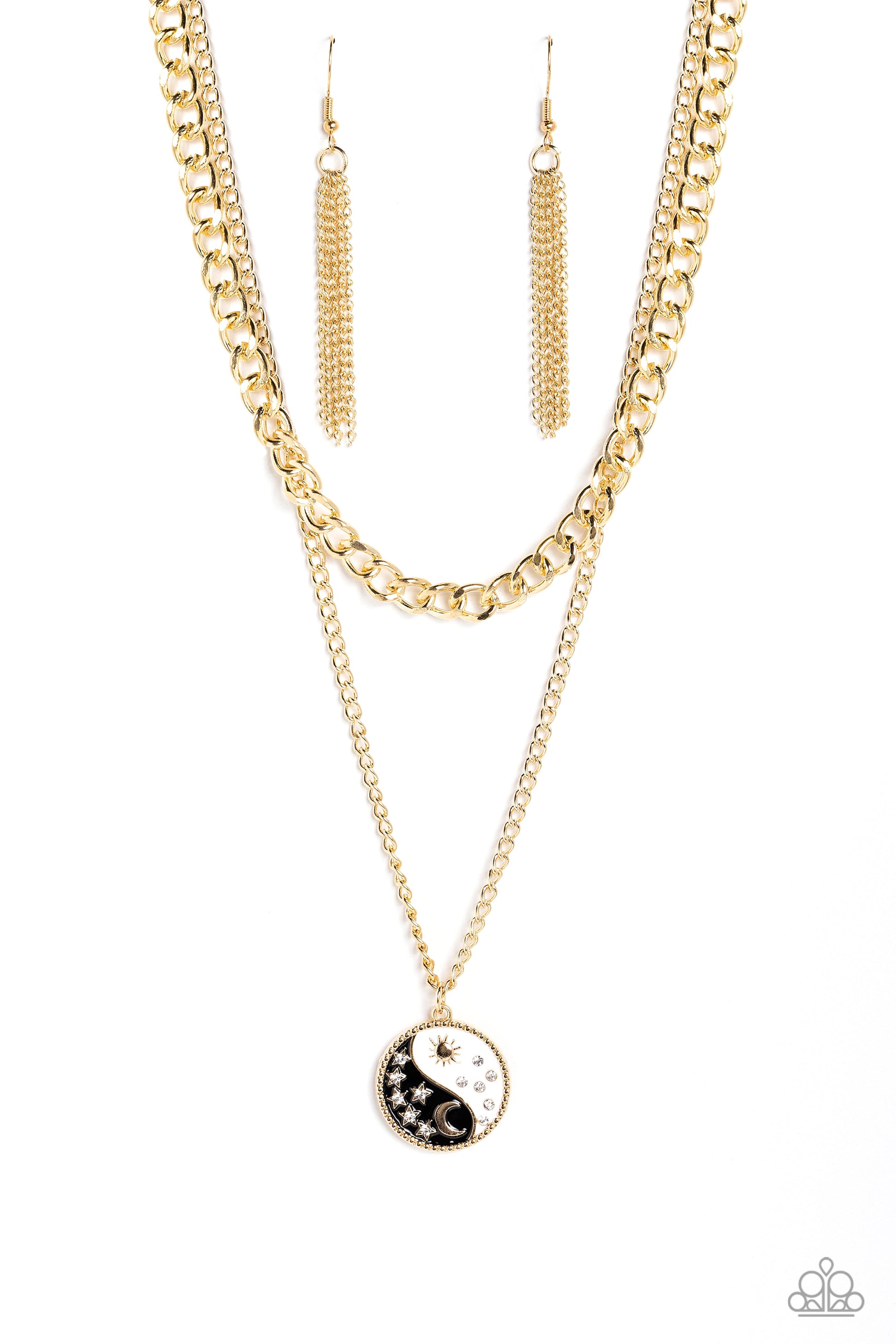 Paparazzi Accessories Night and Day - Black Featuring a yin-yang design, a gold moon with rhinestone-dusted stars rests on the black curve, while a gold sun with rhinestone beams of light rests on the white curve for a balanced, studded display down the n