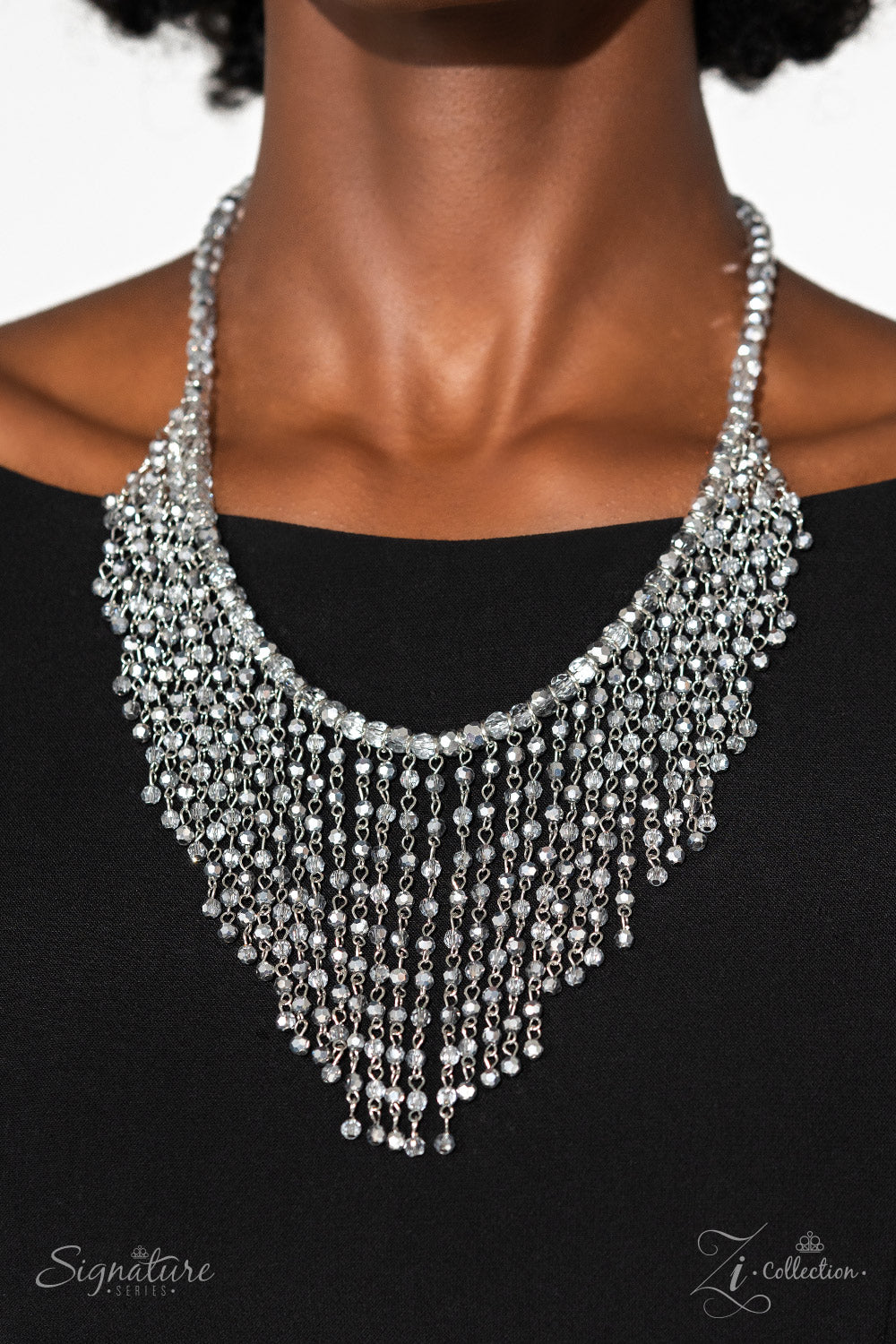 Paparazzi Accessories The Stephanie A collection of small, faceted beads is threaded along an invisible wire, showcasing their irresistible metallic shimmer and range of opacities. Dainty silver chain links, dotted with more of the same faceted beads, dri