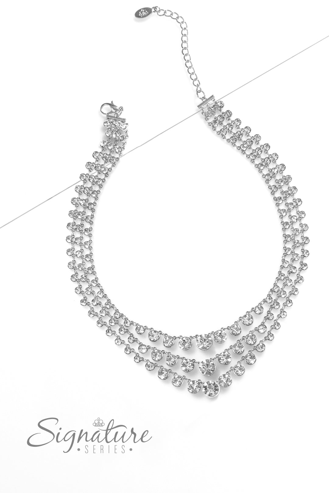 Paparazzi Accessories The Dana Rows of glittery, white rhinestones drape between two sleek silver bars, falling into three luxurious layers. The sparkling gems gradually increase in size as they fall towards the center of the design, adding dazzling dimen