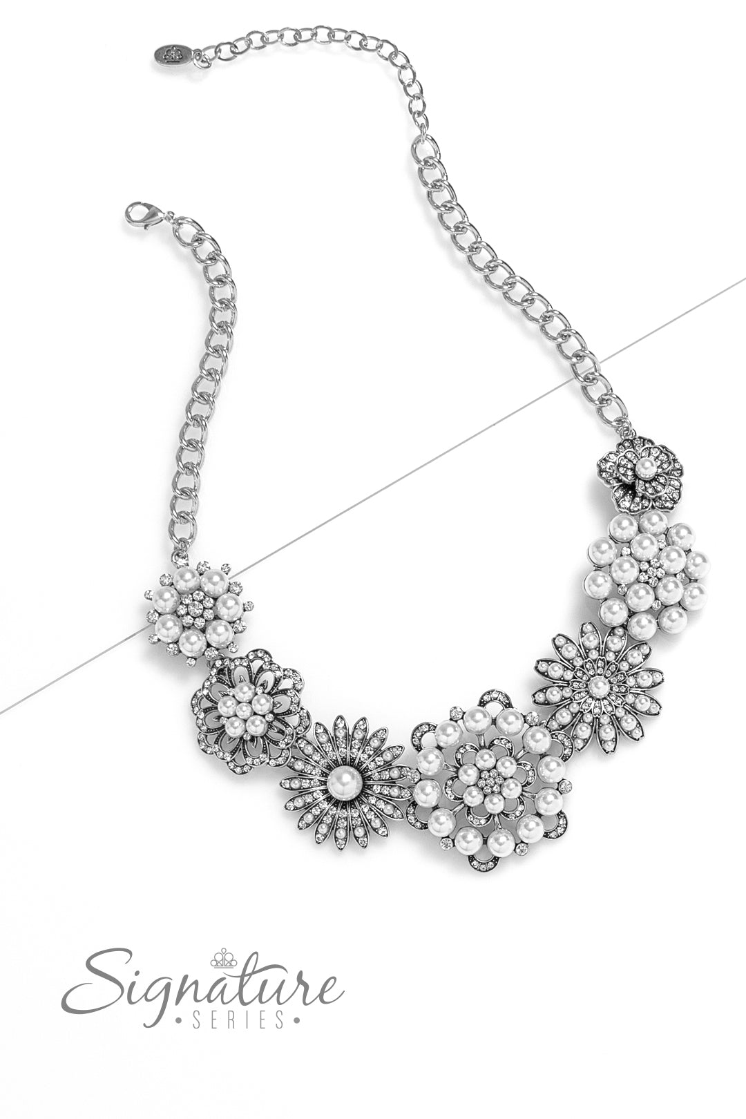 Paparazzi Accessories The Raven Polished white pearls and brilliant white rhinestones bloom atop a framework of silver, forming seven unique flowers adorned in dizzying detail. Each flower features a unique centerpiece encircled by silver petals lined wit