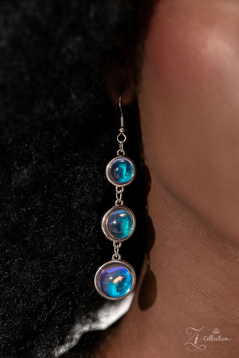 Paparazzi Accessories Hypnotic - Multi A dizzying display of silver hoops drapes across the chest in effervescent layers. Smooth, glassy beads, brushed in swirls of pastel iridescence, bubble up from some of the open, circular frames, further exaggerating
