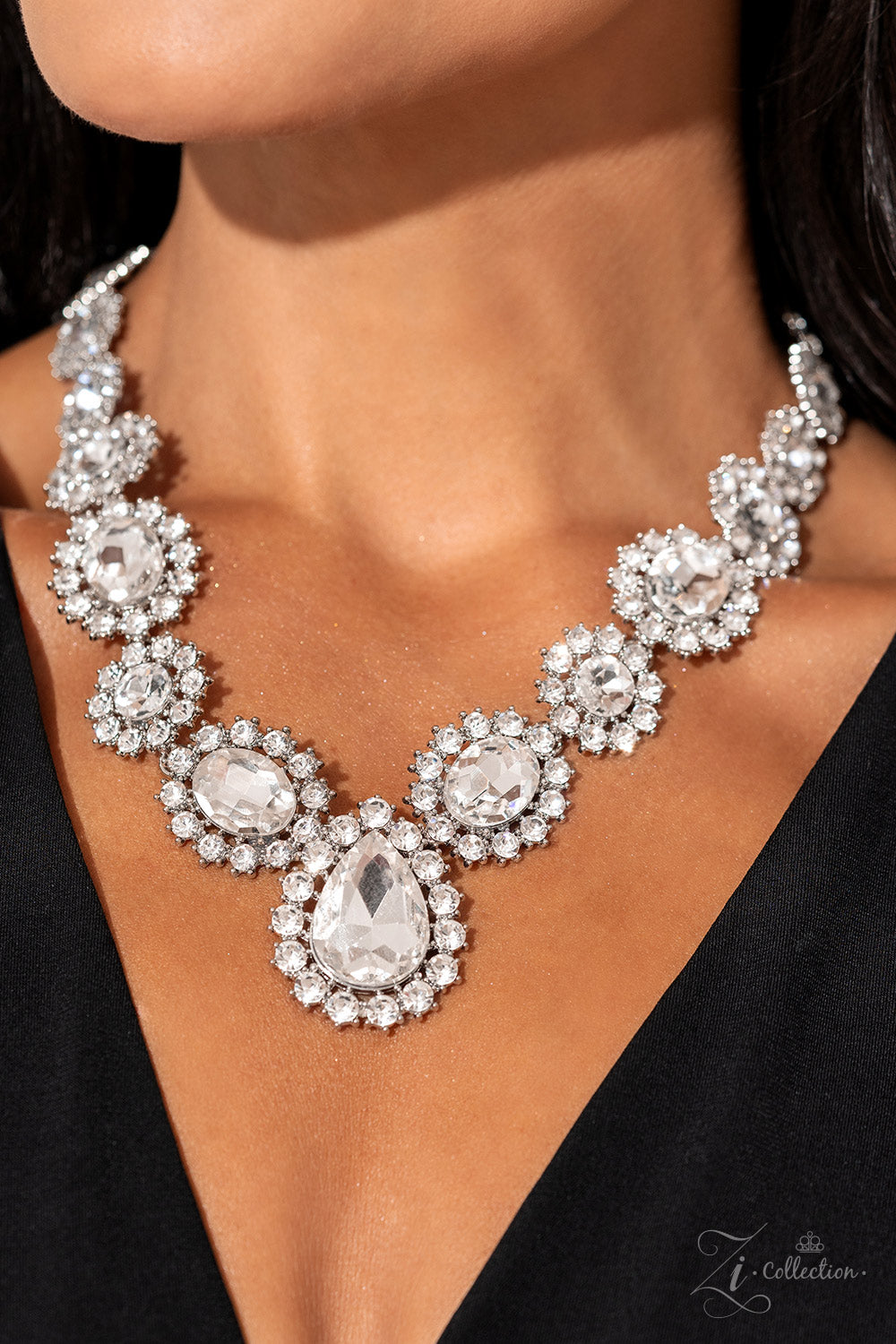 Paparazzi Accessories Everlasting - White Brilliant white rhinestones, in both round and oval cuts, link around the neck in a stunning display. Each dramatically faceted gem is encircled by tiny white rhinestones set in pronged fittings, bringing a vintag