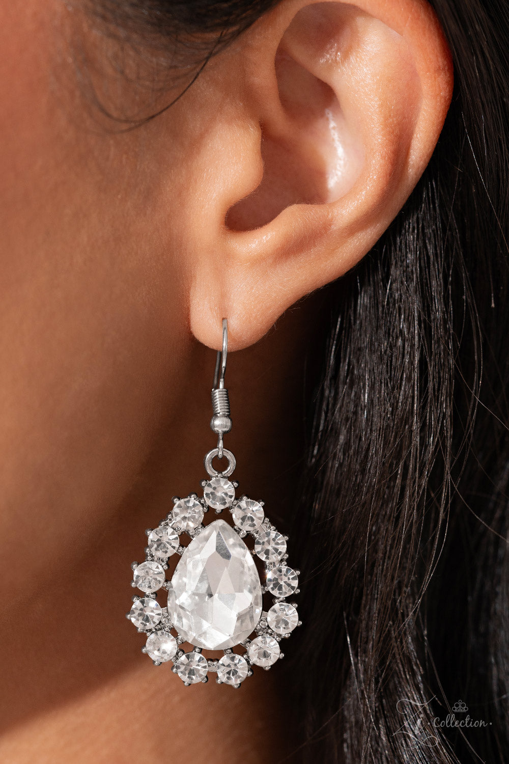 Paparazzi Accessories Everlasting - White Brilliant white rhinestones, in both round and oval cuts, link around the neck in a stunning display. Each dramatically faceted gem is encircled by tiny white rhinestones set in pronged fittings, bringing a vintag