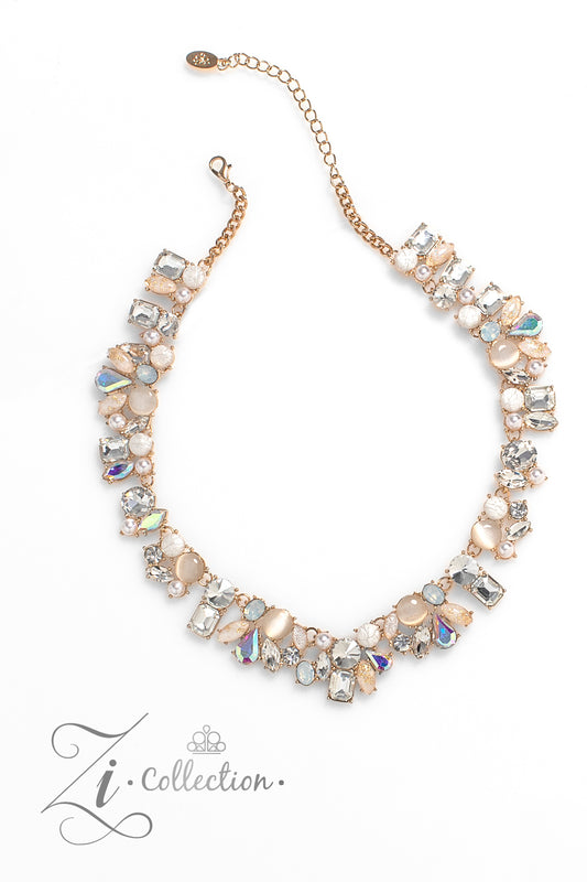 Paparazzi Accessories Enchanting - Gold A treasure trove of textures and sheen emerges along the neckline, as a collection of beads, gems, and pearls group into haphazard clusters. From iridescent teardrops to glowing cat’s eyes, emerald-cut rhinestones t