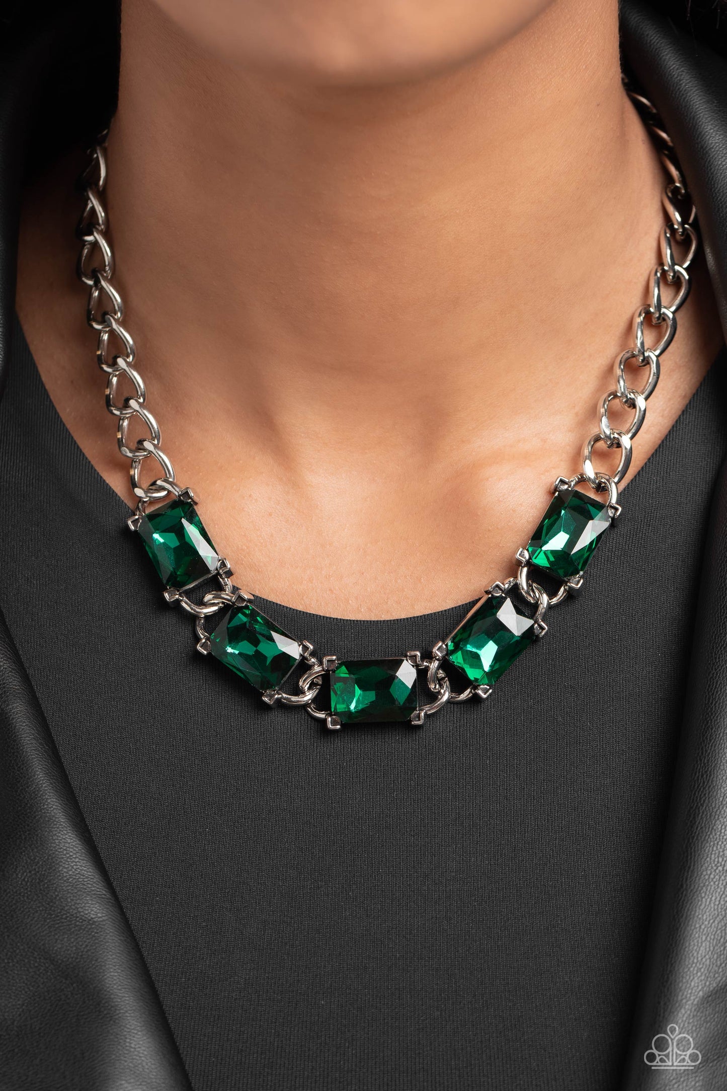Paparazzi Accessories Radiating Review - Green A succession of gleaming, radiant-cut, emerald green gems encased in thick silver frames, coalesces around the neckline on a thick silver curb chain for an edgy statement. Features an adjustable clasp closure