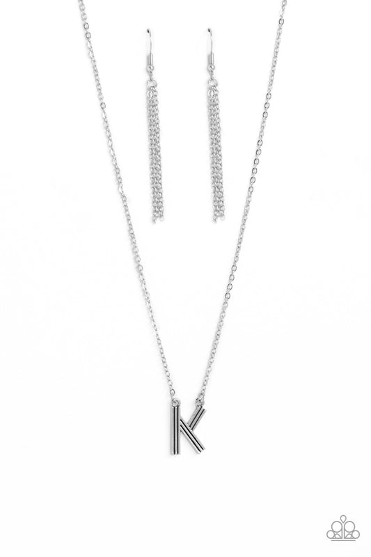 Paparazzi Accessories Leave Your Initials - Silver - K Etched in linear texture, a silver letter "K" hovers below the collar from a dainty silver chain, for a sentimentally simple design. Features an adjustable clasp closure. Sold as one individual neckla