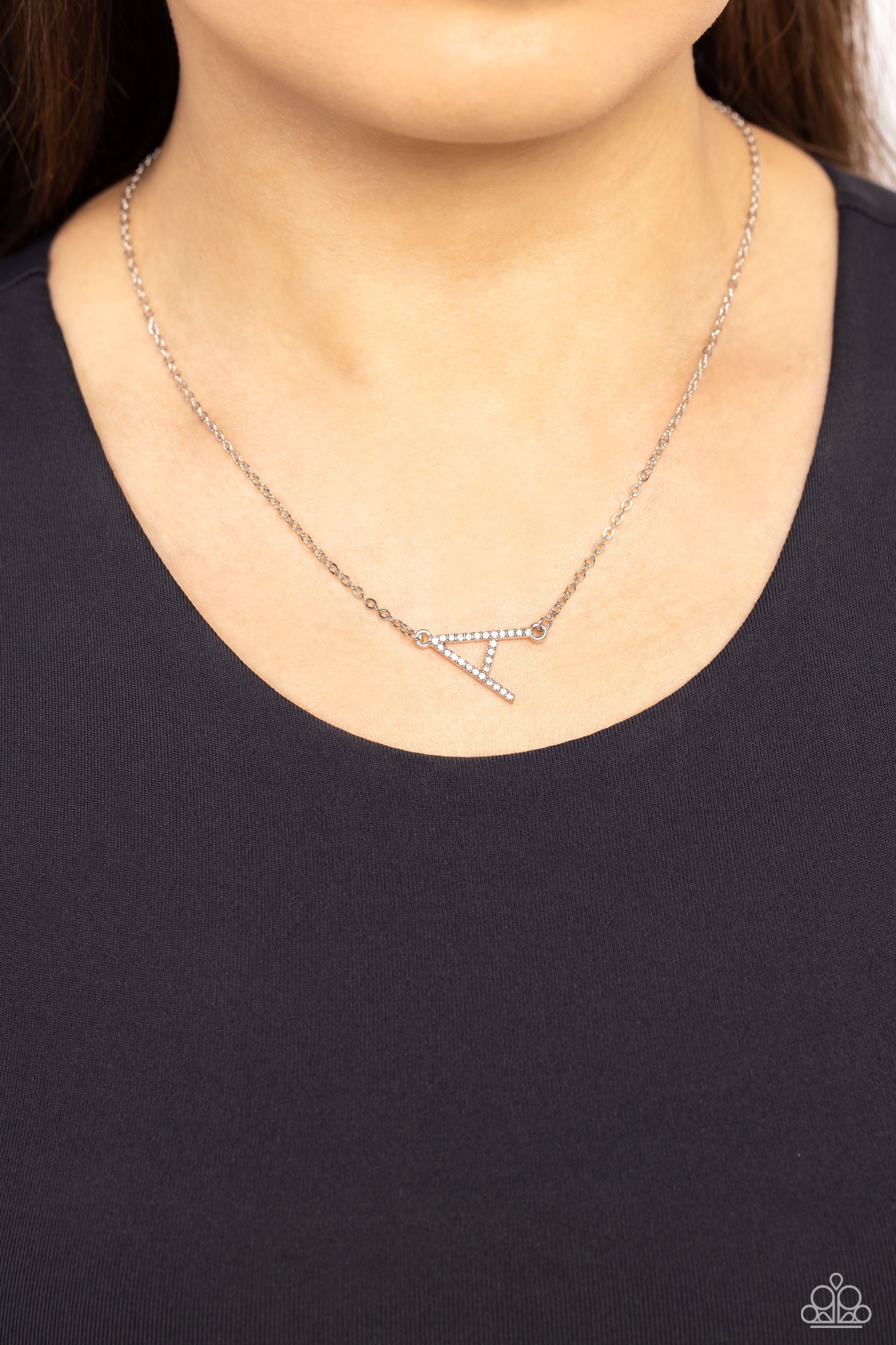 Paparazzi Accessories INITIALLY Yours - A - White Embossed with dainty white rhinestones, a silver letter "A" hovers below the collar from a dainty silver chain, for a sentimentally simple design. Features an adjustable clasp closure. Sold as one individu