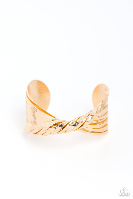 Paparazzi Accessories Radiant Ribbons - Gold Featuring sections of glistening hammered surfaces, high-sheen gold ribbons curl across the center of the wrist in a crisscross motion, coalescing into an intense industrial cuff. Sold as one individual bracele