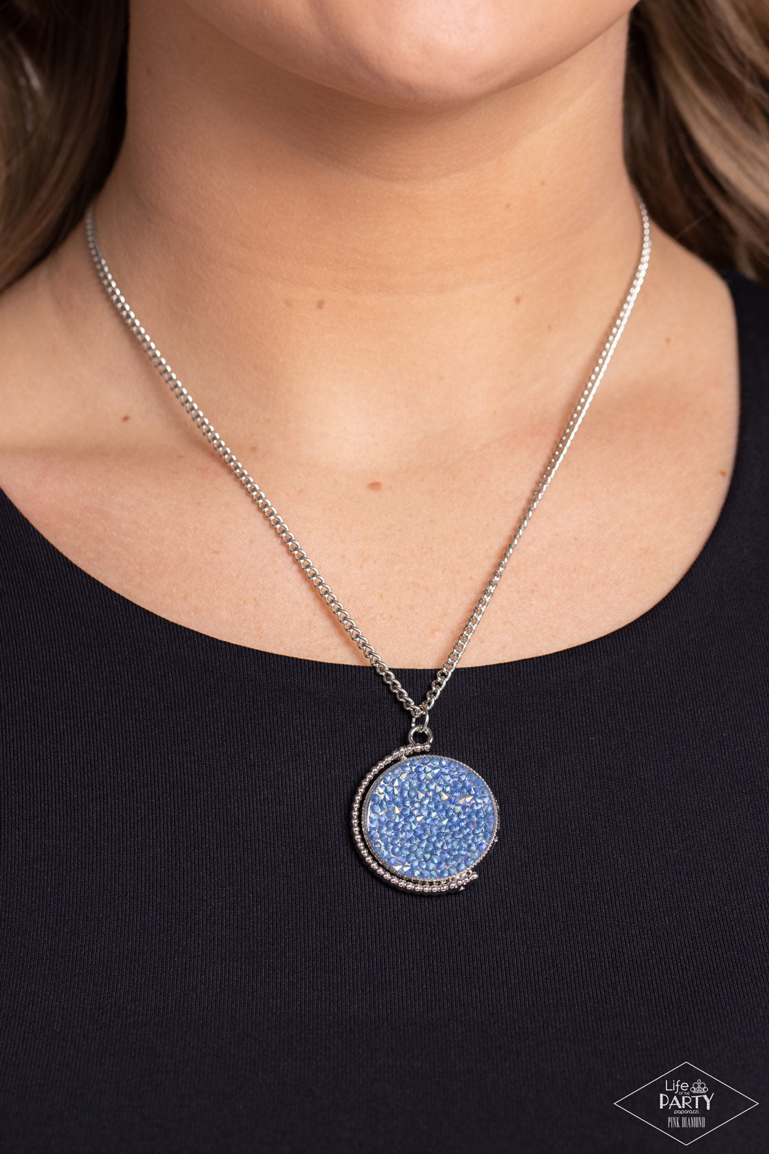 Paparazzi Accessories My Moon and Stars - Multi A smoldering collision of blue iridescent and pink iridescent rhinestones are encrusted across the front and back of a textured silver disc below the collar. Threaded along a dainty rod, the glittery pendant