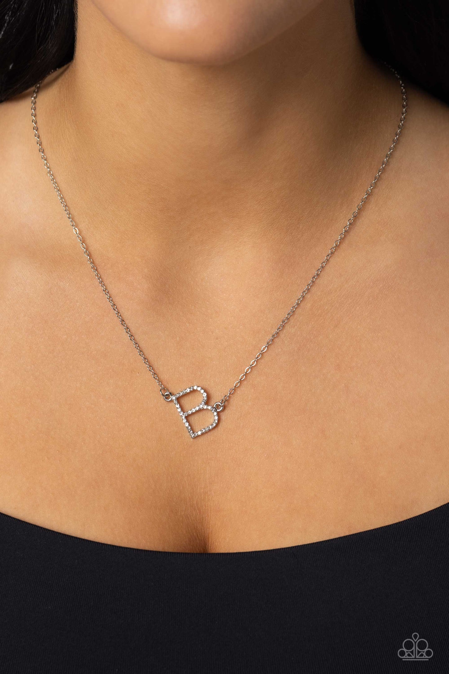 Paparazzi Accessories INITIALLY Yours - B - White Embossed with dainty white rhinestones, a silver letter "B" hovers below the collar from a dainty silver chain, for a sentimentally simple design. Features an adjustable clasp closure. Sold as one individu