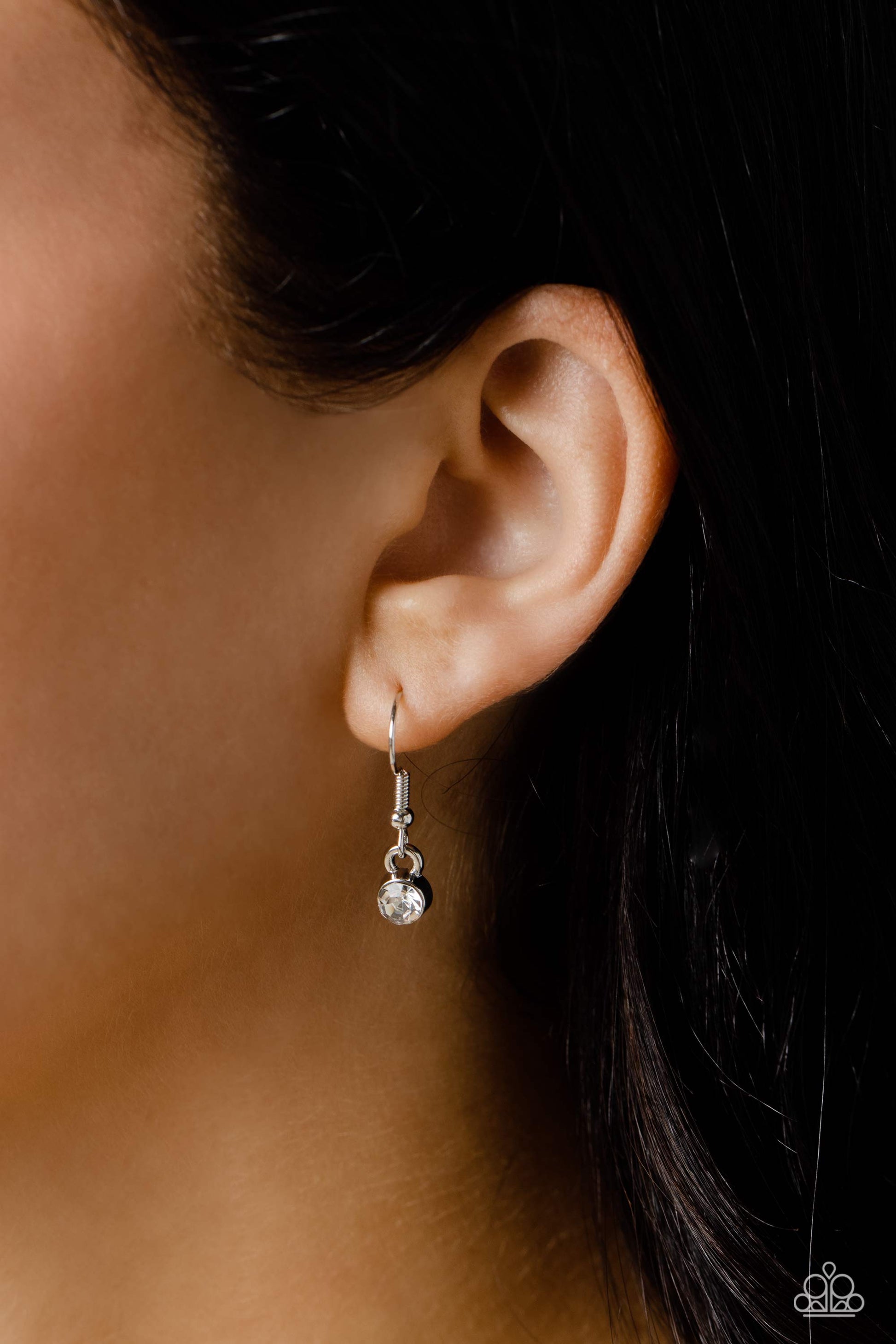 Paparazzi Accessories INITIALLY Yours - V - White Embossed with dainty white rhinestones, a silver letter "V" hovers below the collar from a dainty silver chain, for a sentimentally simple design. Features an adjustable clasp closure. Sold as one individu