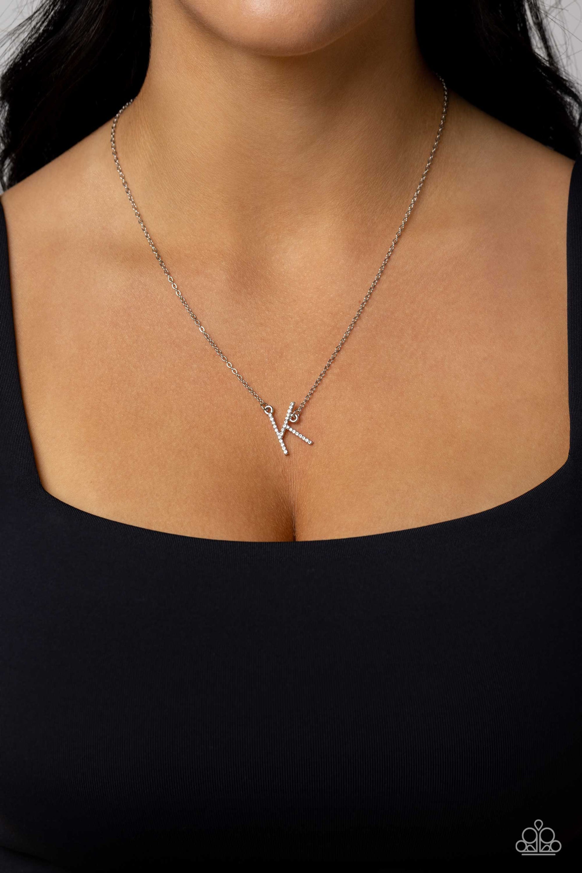 Paparazzi Accessories INITIALLY Yours - K - White Embossed with dainty white rhinestones, a silver letter "K" hovers below the collar from a dainty silver chain, for a sentimentally simple design. Features an adjustable clasp closure. Sold as one individu