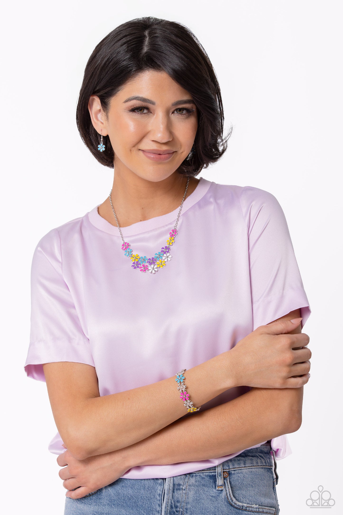 Paparazzi Accessories Floral Fever - Multi Painted in vivacious shades of hot pink, turquoise, yellow, purple, and white, a collection of silver studded flowers glide across the chest from a dainty silver chain for a whimsical array. Features an adjustabl