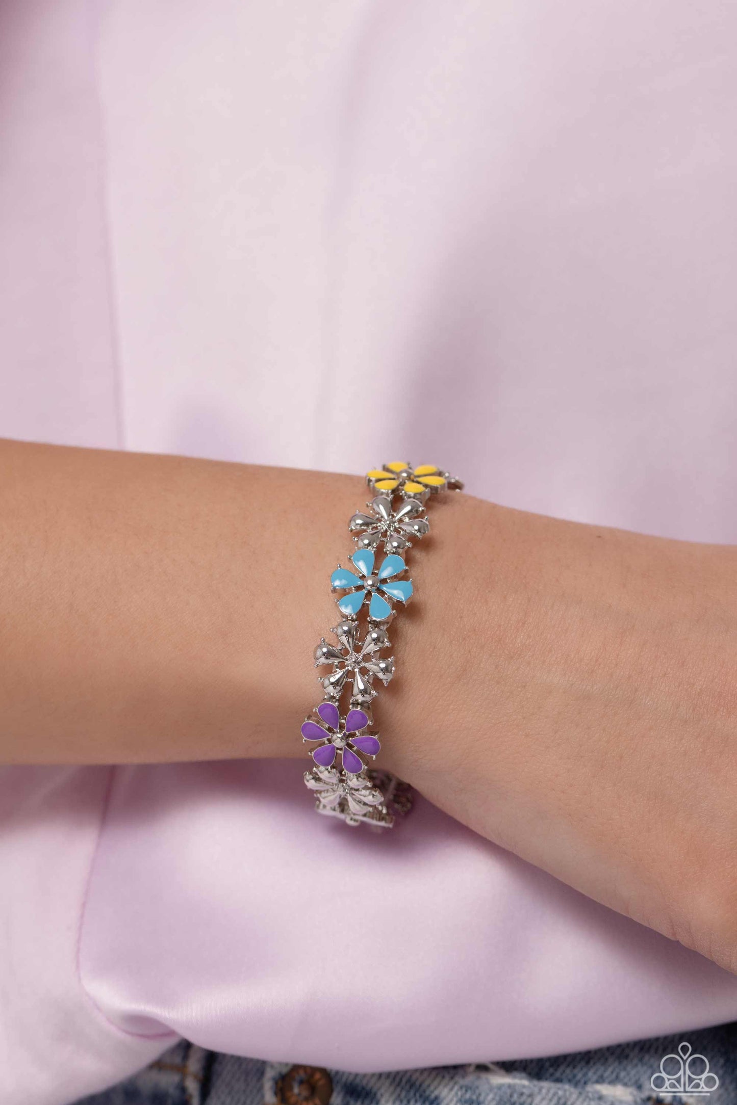 Paparazzi Accessories Floral Fair - Multi Painted in vivacious shades of hot pink, turquoise, yellow, purple, and white, a collection of silver studded flowers alternating with high-sheen silver flowers glides across the wrist from an elastic stretchy ban