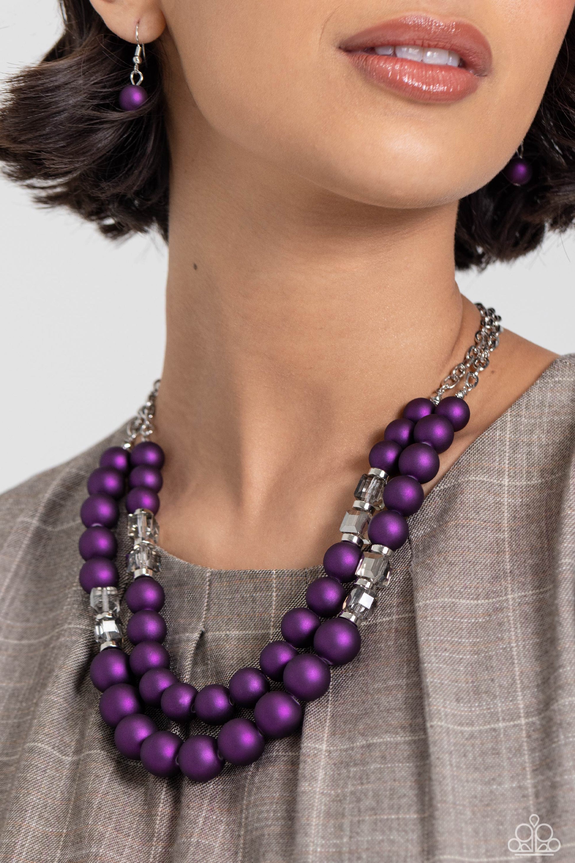 Paparazzi Accessories Shopaholic Season - Purple Two rows of oversized purple beads featuring a subtle shimmer, silver accents, and clear gray cubed beads fall below the collar on silver paperclip chains, creating refined, colorful layers. Features an adj