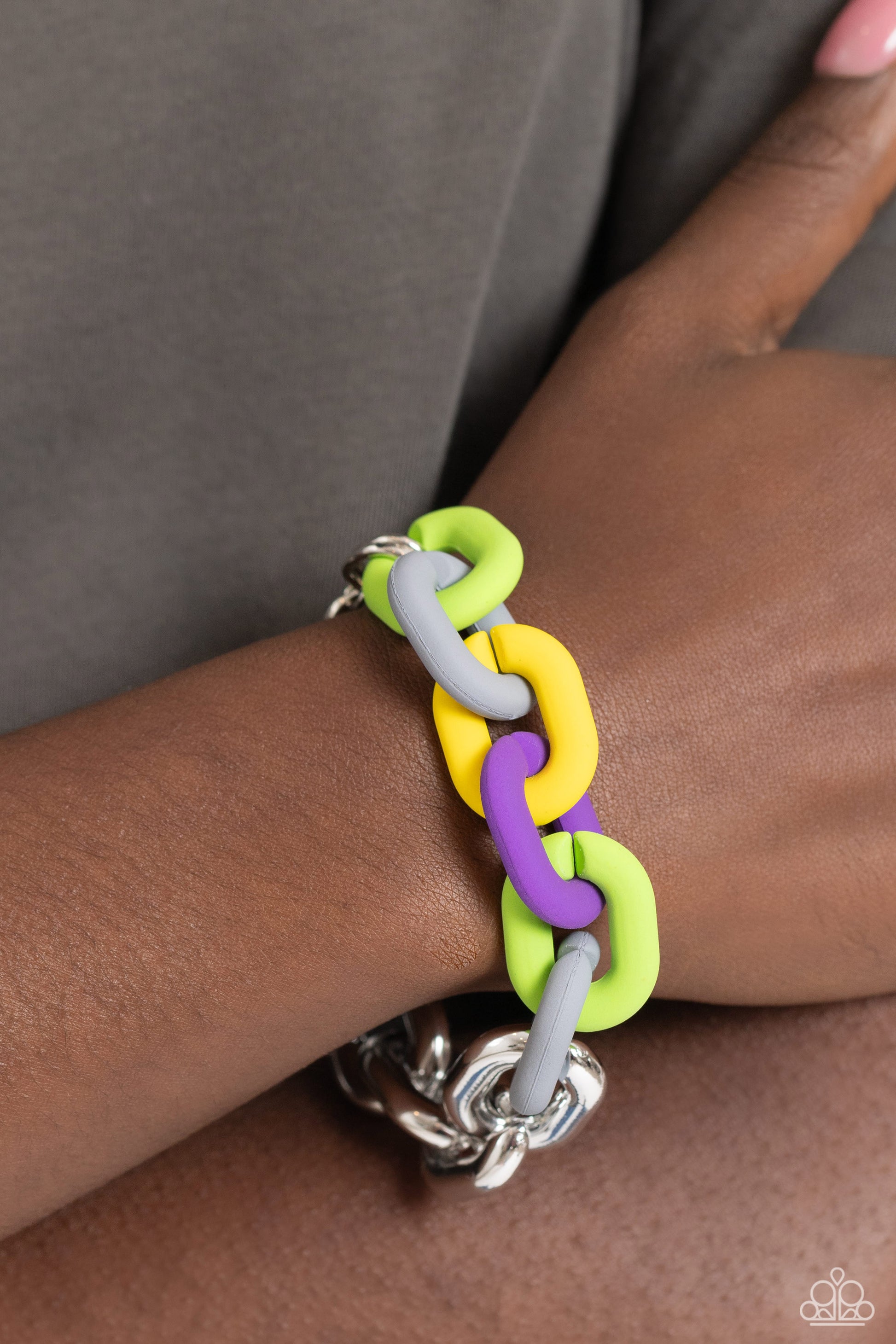Paparazzi Accessories Candid Contrast - Silver A strand of oversized silver curb chain collides with purple, High Visibility, Kohlrabi, and Ultimate Gray acrylic curb links to create an abstract blend of grit and color. The oversized links of the colored