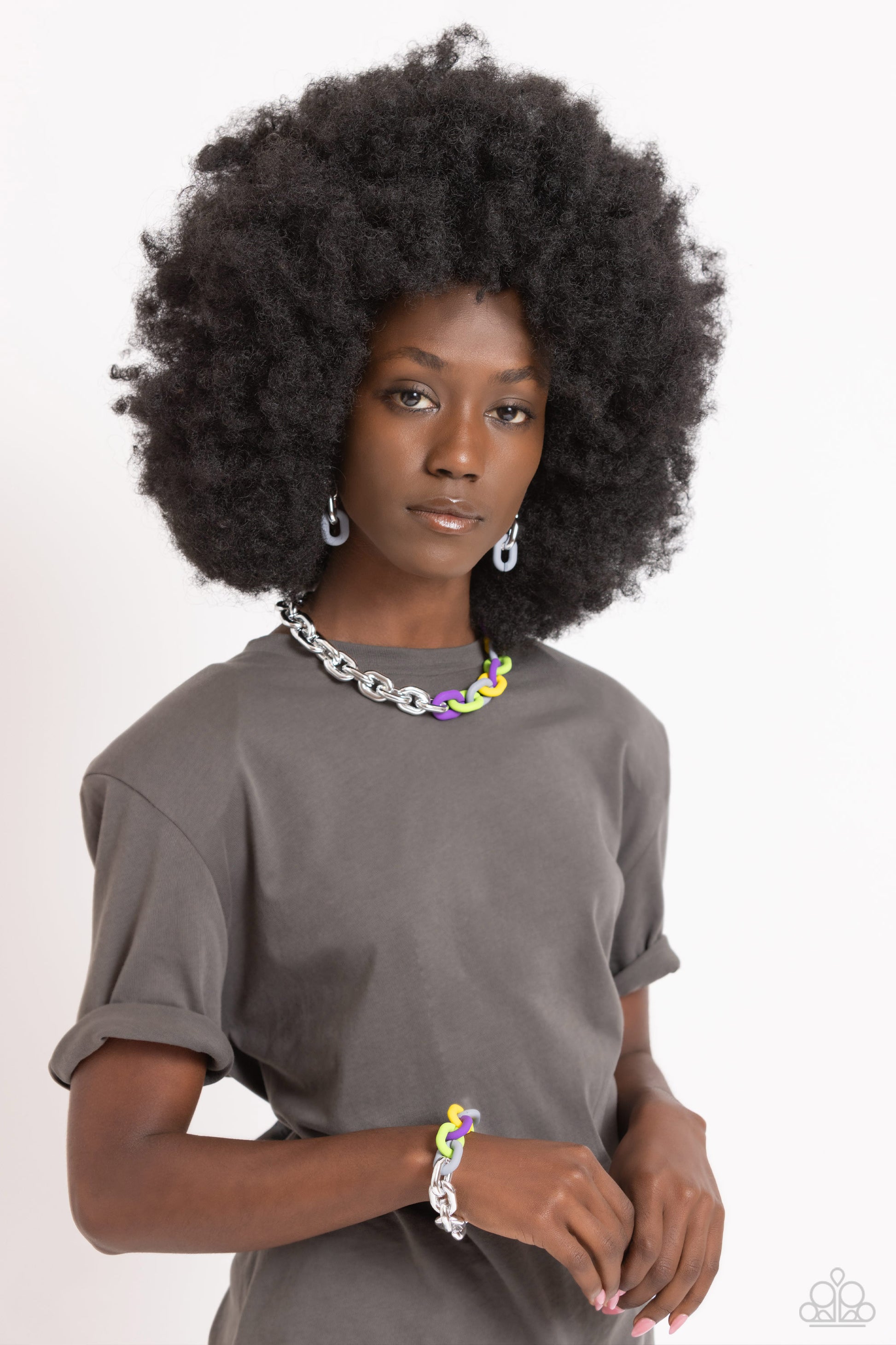 Paparazzi Accessories Candid Contrast - Silver A strand of oversized silver curb chain collides with purple, High Visibility, Kohlrabi, and Ultimate Gray acrylic curb links to create an abstract blend of grit and color. The oversized links of the colored