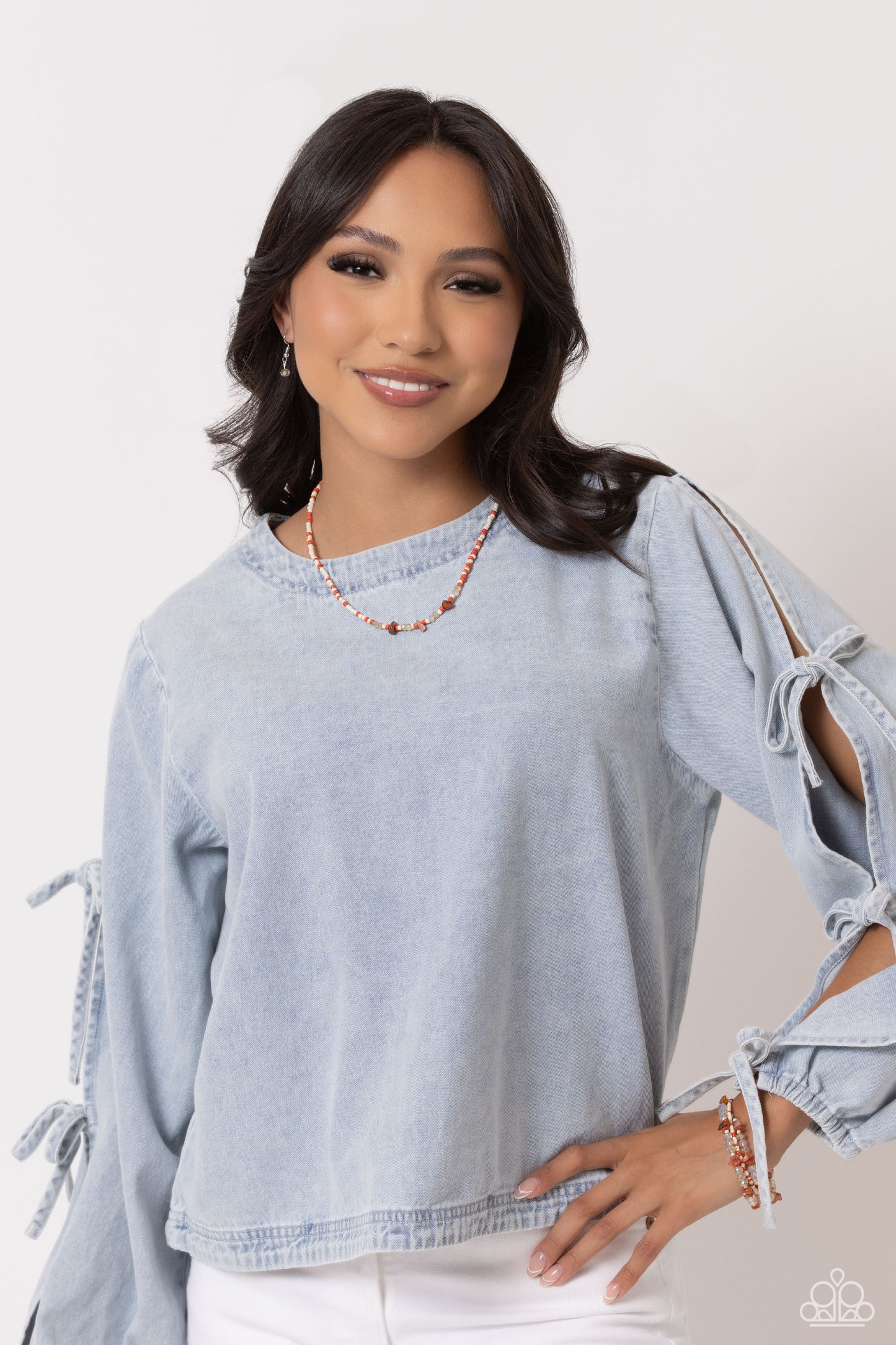 Paparazzi Accessories Notoriously Nuanced - Orange Threaded along a coiled wire, a fashionable collection of Tender Peach, ivory, and Burnt Sienna seed beads and glassy champagne beads combine with chiseled Burnt Sienna natural stones as they coalesce aro