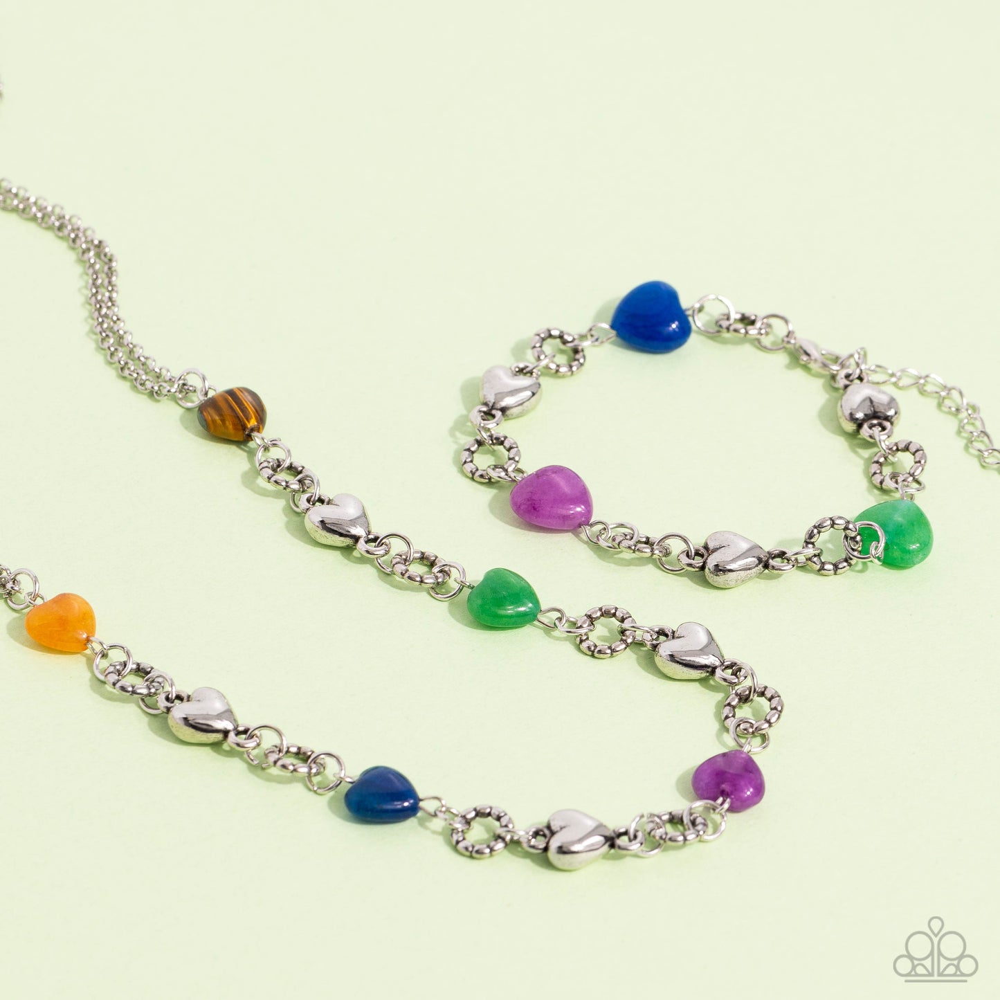 Paparazzi Accessories My HEARTBEAT Will Go On - Multi Heart-shaped lapis, jade, amethyst, tiger's eye, and orange stones and sleek silver hearts alternate along the neckline from a double strand of shimmery silver chains. Bubbly textured silver rings sepa