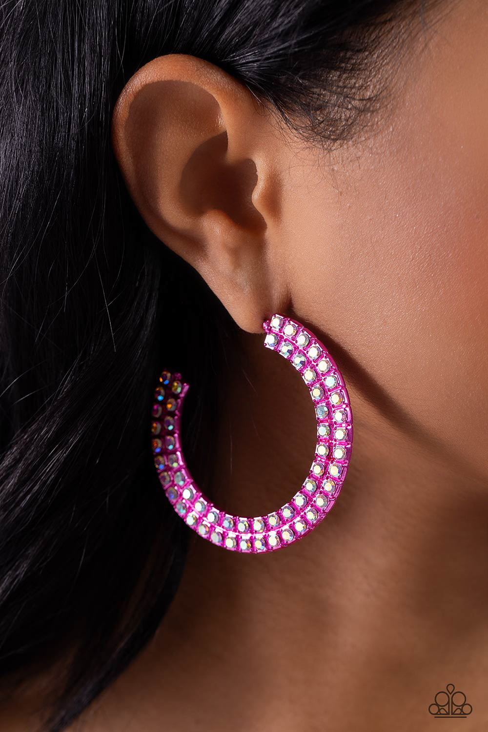 Paparazzi Accessories Flawless Fashion - Pink The outer curve of an oversized thick metallic pink hoop is encrusted in a staggered double row of dazzling iridescent rhinestones for a flawless look. Earring attaches to a standard post fitting. Hoop measure