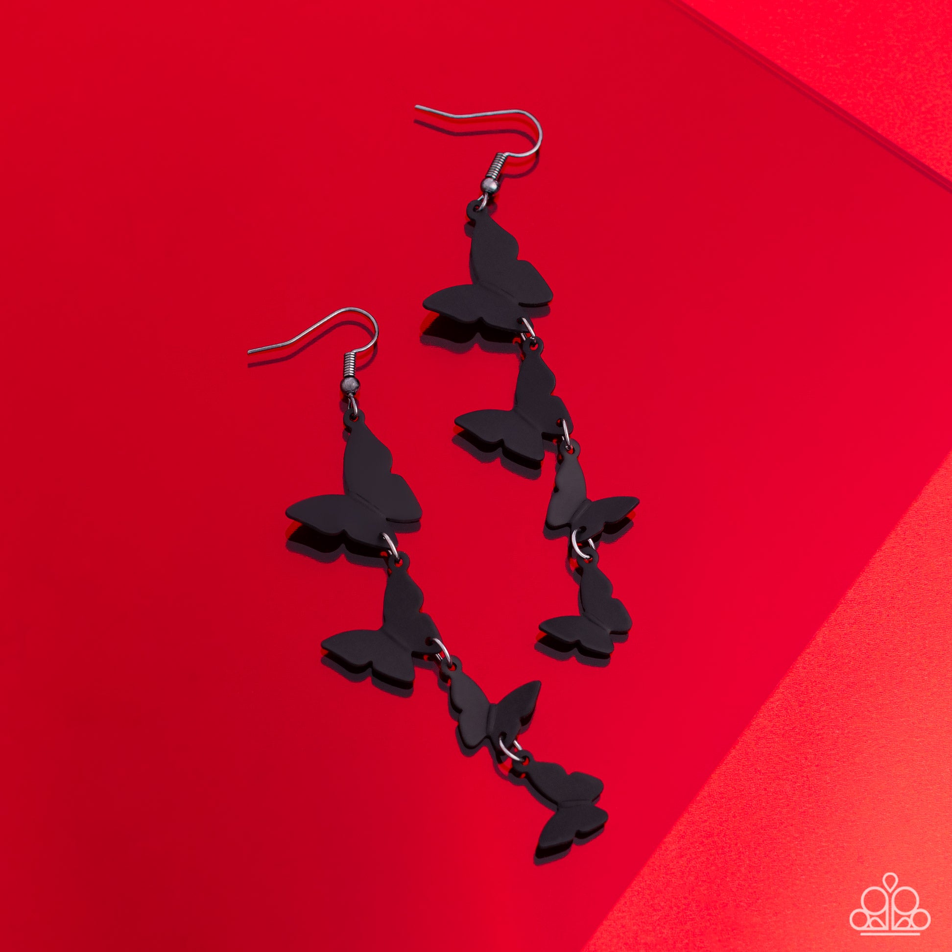 Paparazzi Accessories Haphazard Headliner - Black A collection of black butterflies fall from the ear in an alternating, haphazard pattern, slowly decreasing in size, culminating in a whimsical lure. Earring attaches to a standard fishhook fitting. Sold a