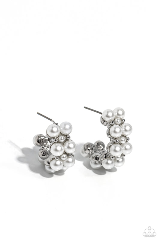 Paparazzi Accessories White Collar Wardrobe - White Two rows of bubbly white pearls stack and form into a scalloped pattern. Daintily curling around the ear, the bubbly effect of the high-sheen silver studs and daintier pearls separating the larger pearls