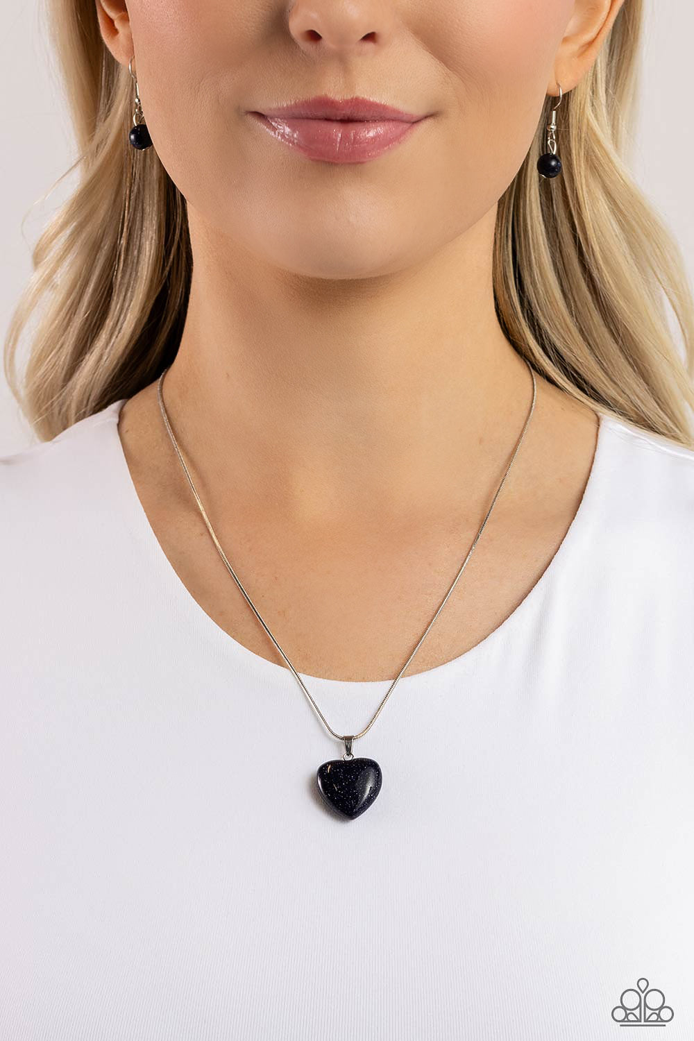 Paparazzi Accessories Prismatic Pastime - Blue Brushed in a glittery finish, a dark blue heart dangles at the bottom of a lengthened silver snake chain, creating a glittery pendant. Features an adjustable clasp closure. Sold as one individual necklace. In