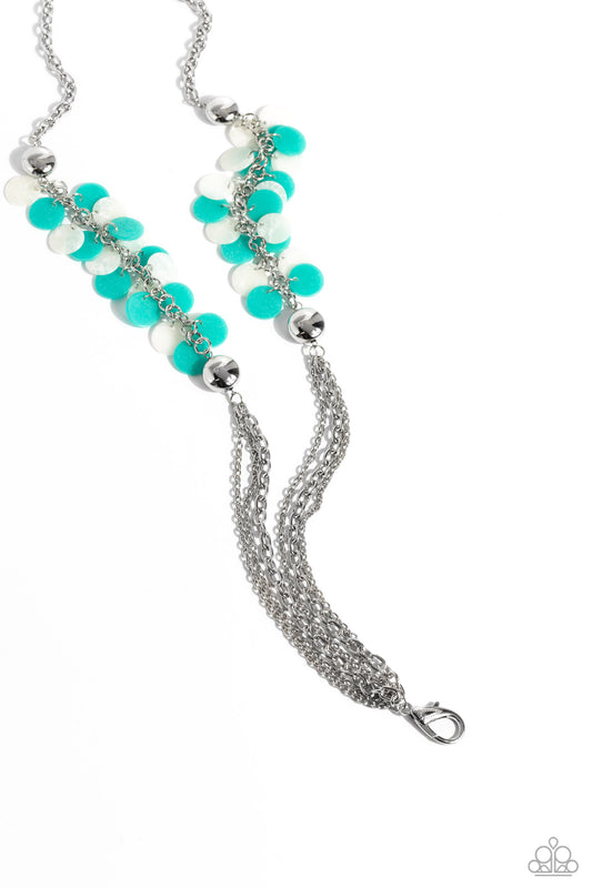 Paparazzi Accessories Shell Sensation - Green *Lanyard Flared between two oversized silver beads, a collection of turquoise and white shell-like beads give way to sections of silver chains that connect across the chest for a colorful summery look. A lobst