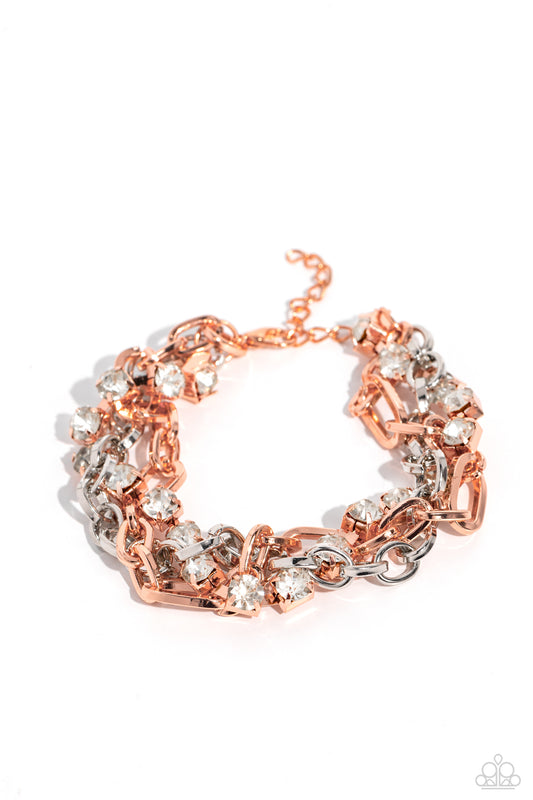 Paparazzi Accessories Two-Tone Taste - Copper Mismatched strands of glistening shiny copper and silver oval links are intertwined with a row of sparkling, square-cut, white rhinestones encased in sleek shiny copper fittings, resulting in a twisted collisi