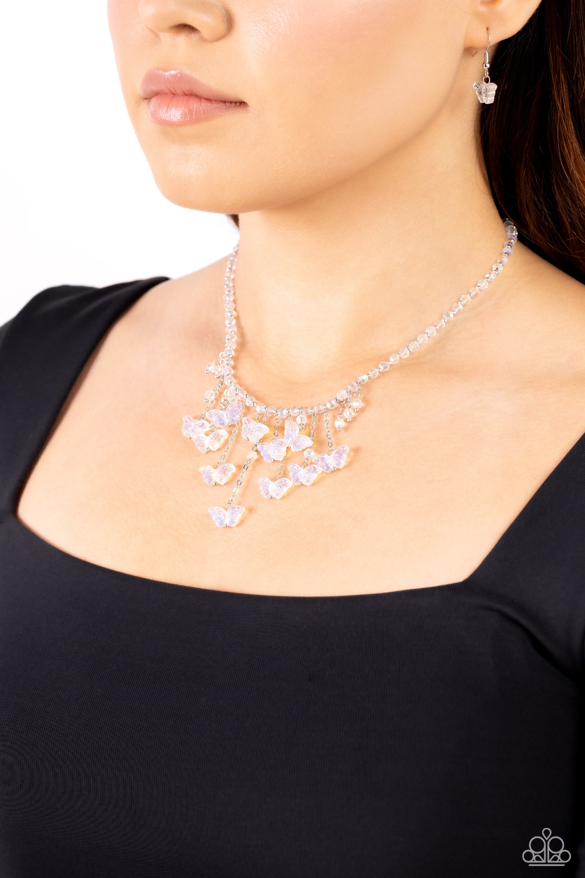 Paparazzi Accessories Majestic Metamorphosis - White Featuring a vibrant iridescence, a glittery strand of white beads alternating with dainty silver studs streams around the collar for a refined flair. Varying in length, intricate-detailed iridescent but