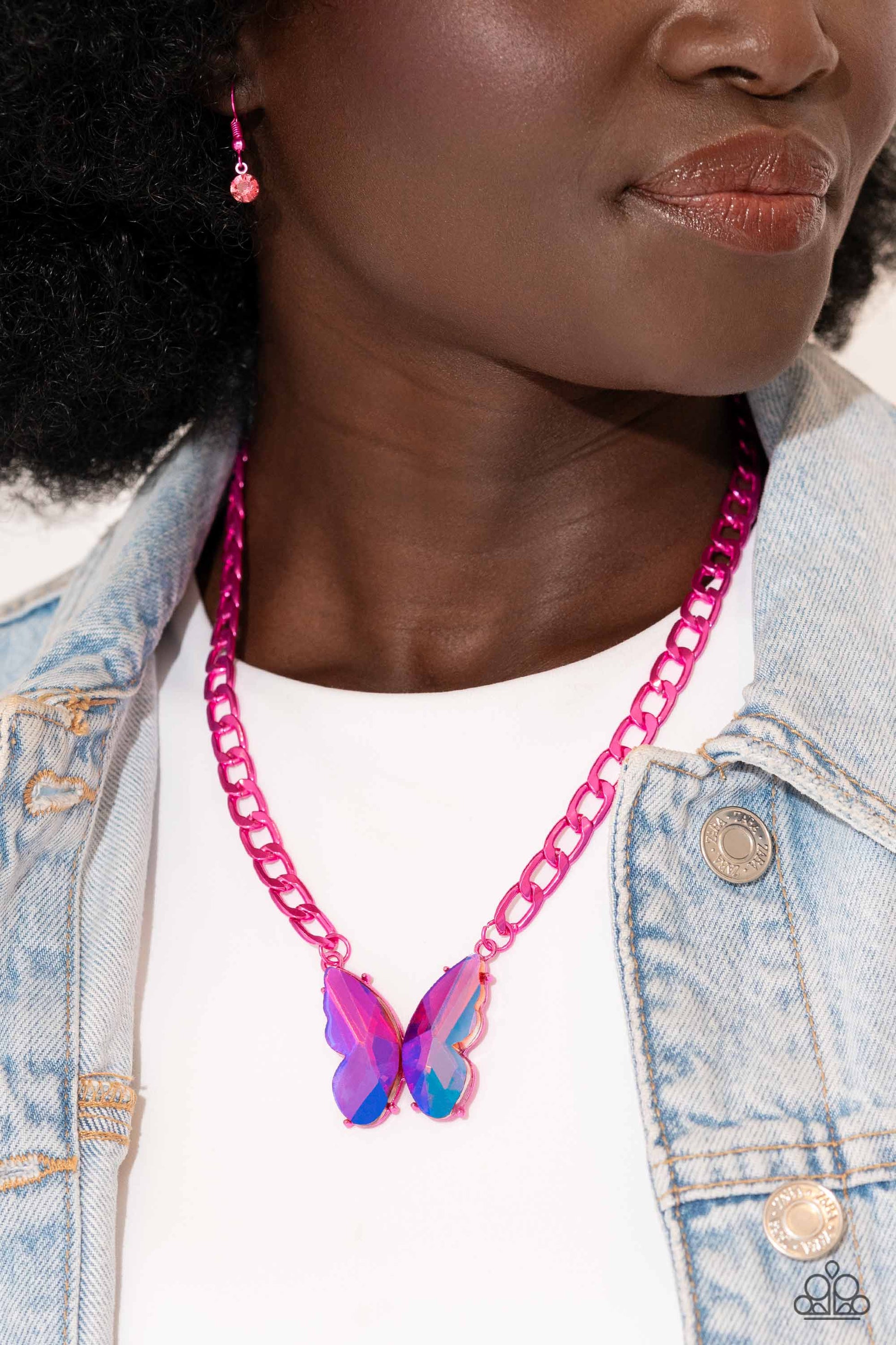 Paparazzi Accessories Fascinating Flyer - Pink Featuring a UV finish, a pair of oversized pink gem wings form into a pronged butterfly frame at the bottom of an electric pink curb chain for a vibrant, whimsical display. Features an adjustable clasp closur