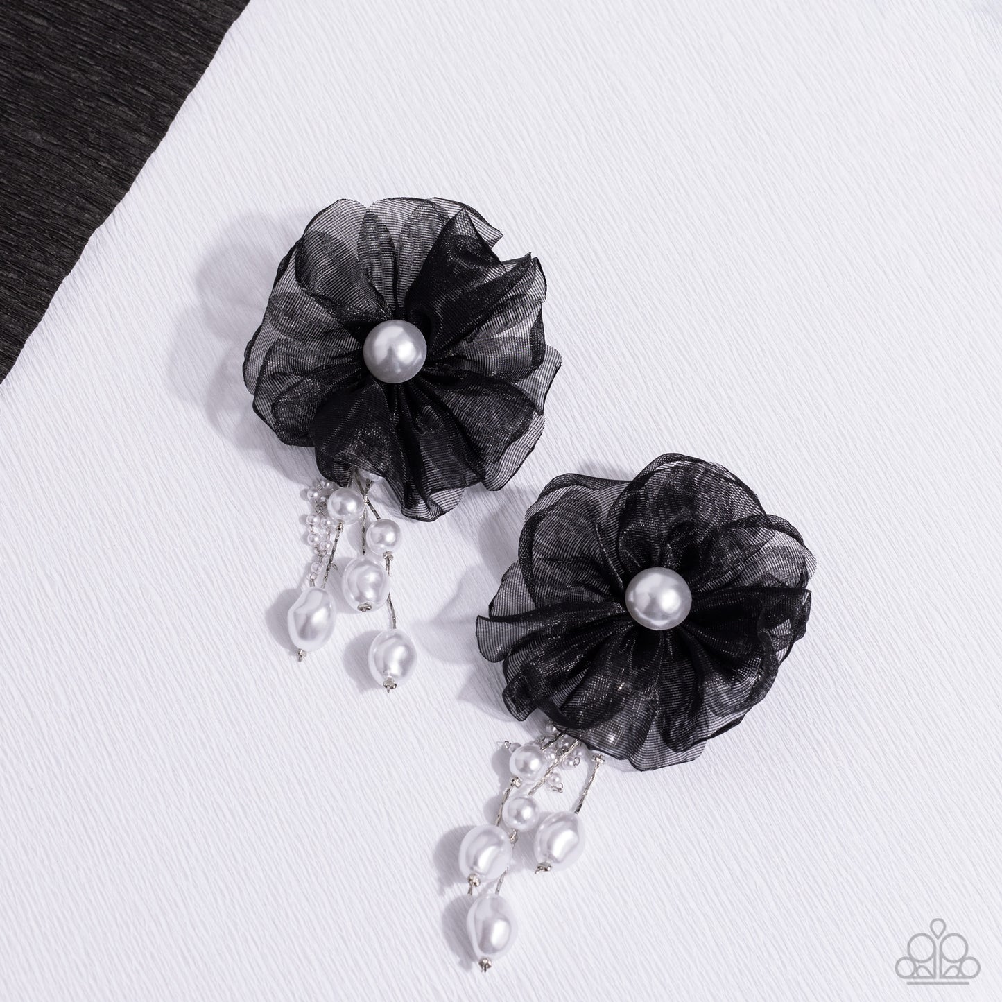 Paparazzi Accessories Dripping In Decadence - Black Folds of black netting gather around a glossy white pearl center, creating a spunky blossom. Cascading from the black netted petals, various white pearls in glossy, baroque, and dainty settings are infus