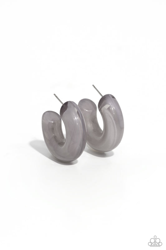 Paparazzi Accessories Acrylic Acclaim - Silver Featuring a milky accent, thick gray acrylic frames snugly loop and curl just below the ear for a fashionable finish. Earring attaches to a standard post fitting. Hoop measures approximately 1" in diameter. S
