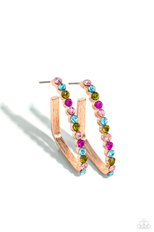 Paparazzi Accessories Triangular Tapestry - Rose Gold The front of a bold rose gold hoop is encrusted in multicolored rhinestones, creating a sparkly spectrum of color. The multicolored scalloped frame leisurely bends into an airy triangular frame for a g