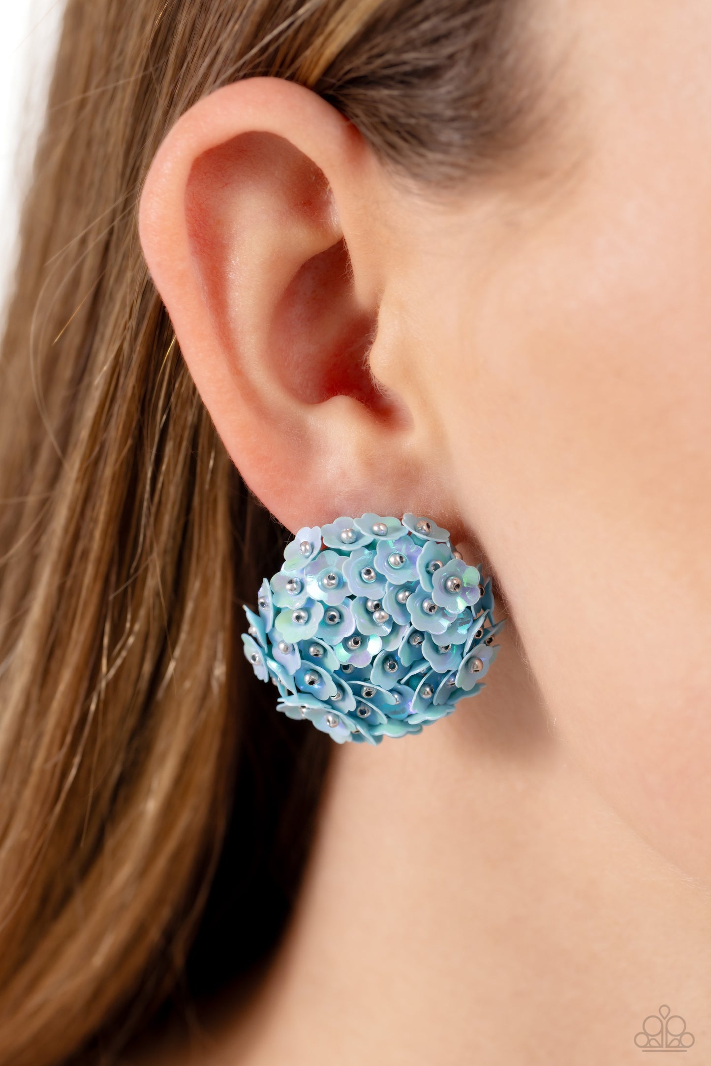 Paparazzi Accessories Corsage Character - Blue Featuring a light iridescent sheen, light blue flowers with silver stud centers explode around the ear to create a whimsical bouquet-inspired statement. Earring attaches to a standard post fitting. Sold as on