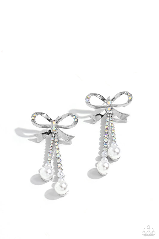 Paparazzi Accessories Bodacious Bow - Multi Adorned in sparkling iridescent rhinestones, high-sheen bands of silver curl and loop into a stunning bow charm, creating a classy statement at the ear. Iridescent rhinestones encased in scalloped silver fitting