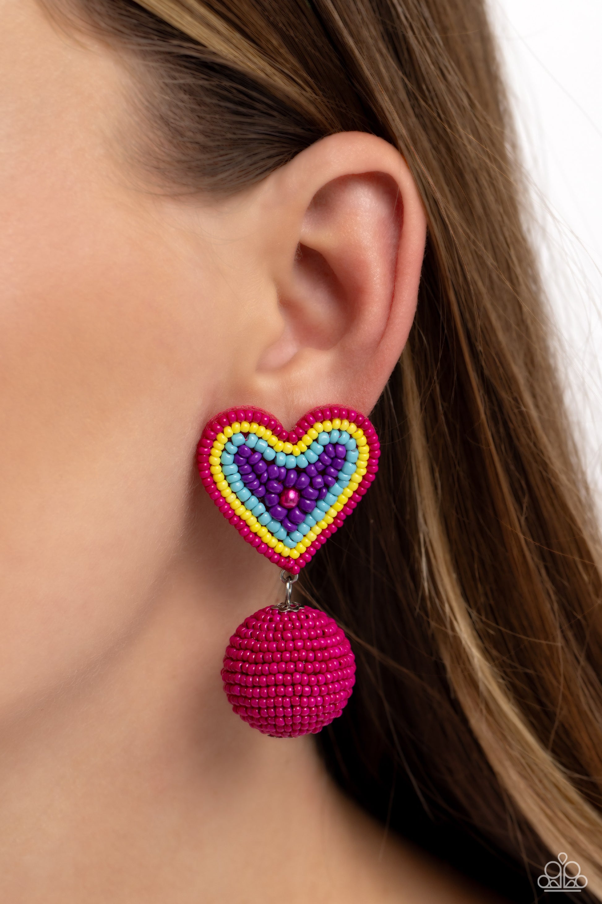 Paparazzi Accessories Spherical Sweethearts - Multi Featuring a hot pink pearl center, a hot pink, yellow, turquoise, and purple seed bead heart frame gives way to strands of hot pink seed beads that decoratively spin around a spherical frame, resulting i