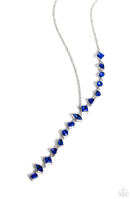 Paparazzi Accessories Diagonal Daydream - Blue Featuring a pronged fitting, a collection of royal blue square-cut, heart, oval, round, and teardrop gems cascade down the neckline in a diagonal pattern, creating an intense, incandescent statement piece. Fe
