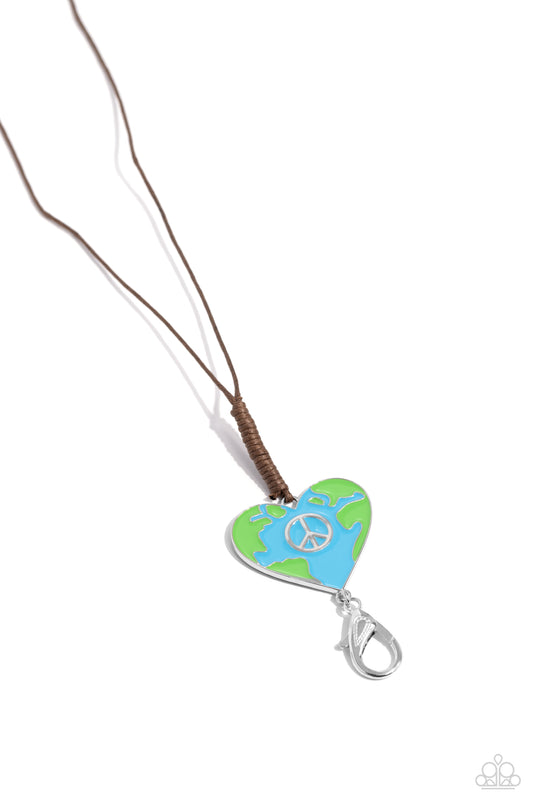 Paparazzi Accessories Earthy Evolution - Blue Featuring a silver peace sign center, a heart frame painted in an earth motif in Classic Green and blue hues is knotted in place at the bottom of a lengthened brown cord for a seasonal flair. A lobster clasp h