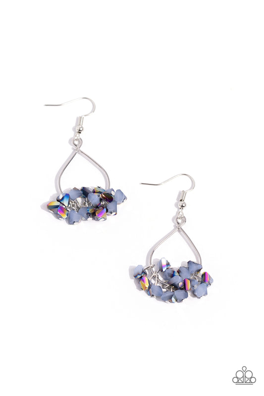 Paparazzi Accessories Charm of the Century - Blue Featuring an oil spill finish, a collection of chiseled blue beads cluster at the bottom of a sleek silver teardrop frame, creating a stellar fringe. Earring attaches to a standard fishhook fitting. Sold a