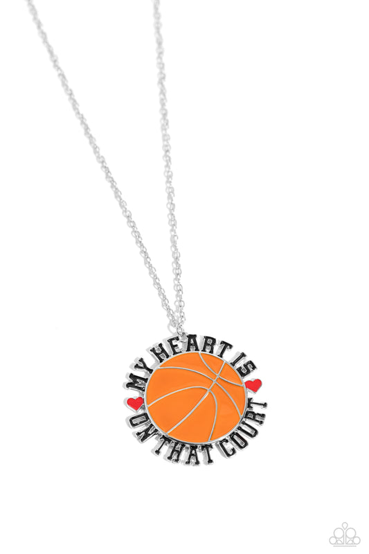 Paparazzi Accessories Courting Courtside - Orange Dangling from an extended dainty silver chain, an oversized orange-painted basketball pendant features the phrase "My Heart is on that Court" in all caps and black lettering as it wraps around the ball. Re