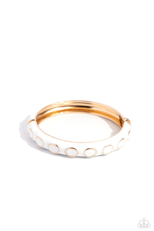 Paparazzi Accessories Delightful Diversion - White Embedded along a white-painted, scalloped cuff, sleek gold rings dot across the center of the wrist for a versatile pop of color. Features a hinged closure. Sold as one individual bracelet. Jewelry