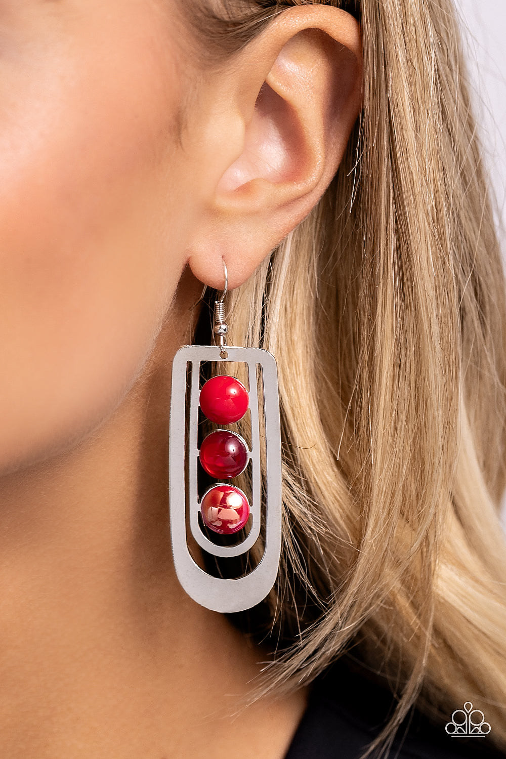 Paparazzi Accessories Layered Lure - Red Red acrylic, red opal, and red UV-splashed beads are set in the center of two overlapping silver U-shaped frames, creating a rippling lure. Earring attaches to a standard fishhook fitting. Sold as one pair of earri