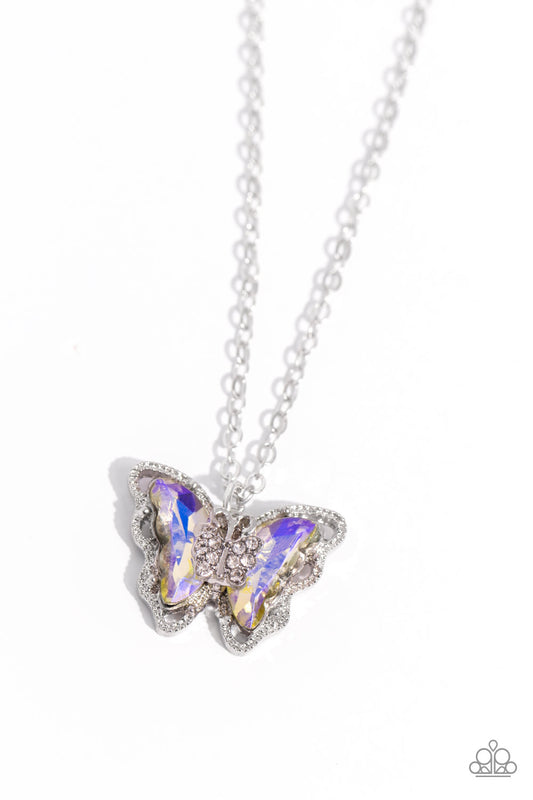 Paparazzi Accessories Whispering Wings - Yellow A whimsical yellow UV-brushed butterfly with a silver-studded outline elegantly slides along a dainty silver chain. A smaller white rhinestone-encrusted silver butterfly is nestled at the center of the large
