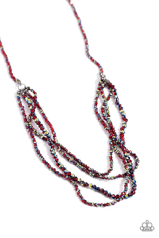 Paparazzi Accessories Candescent Cascade - Red Dipped in a metallic sheen, a strand of faceted red and UV beads coalesce down the chest. Four of the same beaded strands cascade in layers from the single strand for a glamorous finish. Features an adjustabl