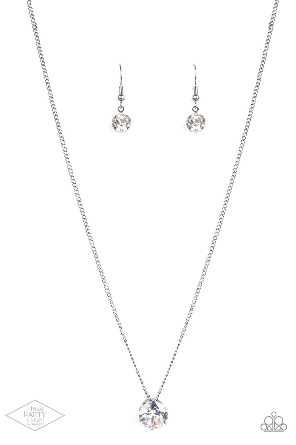 Paparazzi Accessories What A Gem - Gunmetal A single rhinestone sparkles brilliantly at the bottom of a dainty gunmetal chain, creating a stunning solitaire design. Features an adjustable clasp closure. Sold as one individual necklace. Includes one pair o