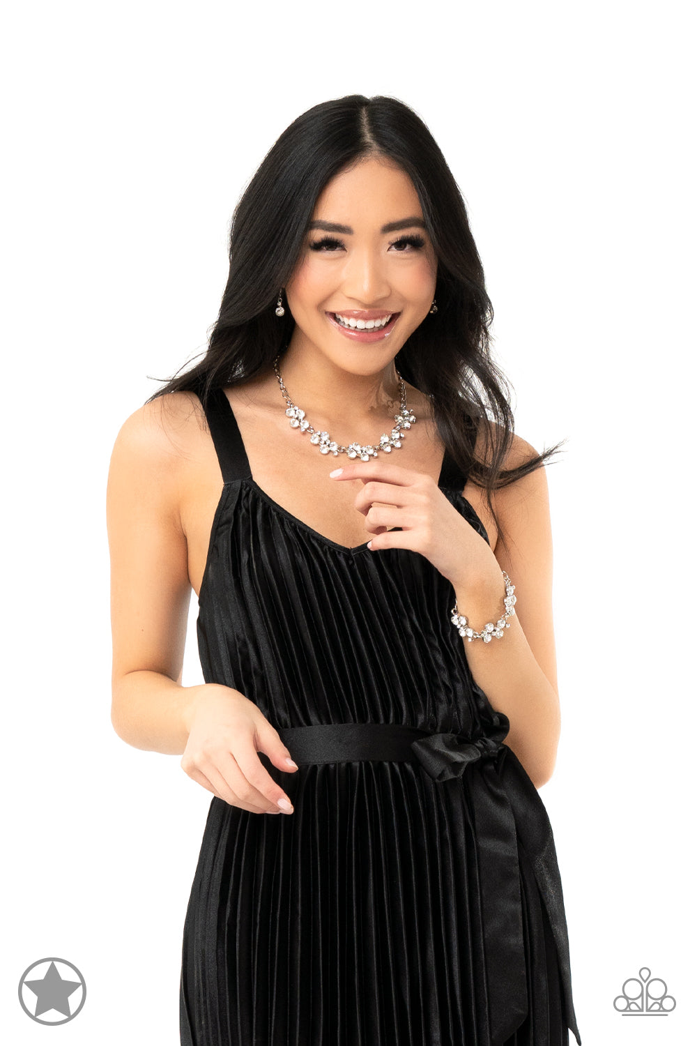 Paparazzi Accessories Hollywood Hills - White A row of dazzling white rhinestones drapes along the neckline, creating a sparkling display. Daintier white rhinestones are sprinkled along the clusters, adding luminous detail to the timeless design. Features
