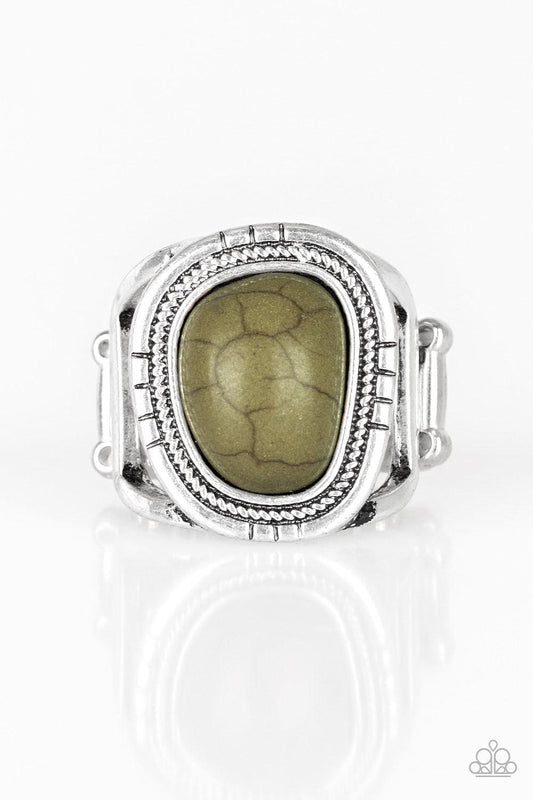 Paparazzi Accessories Out On The Range - Green An earthy Military Olive stone is pressed into an asymmetrical silver frame radiating with tactile textures for a seasonal look. Features a stretchy band for a flexible fit. Sold as one individual ring. Jewel